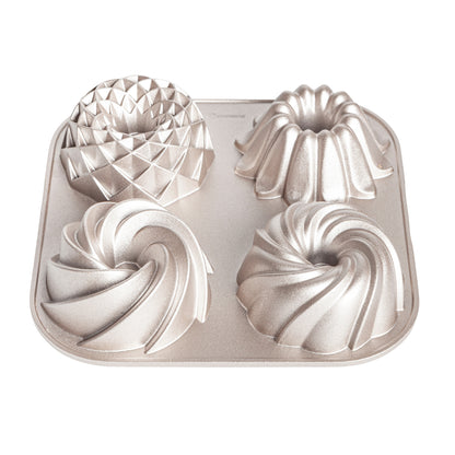 Moule TETRAD pour 4 mini cakes, diamètre 10 cm x 4,5 cm de hauteur, Double Couche Antiadhésive, Fonte d'Aluminium Résistante, Cuisson Uniforme, Couleur Or Rose.